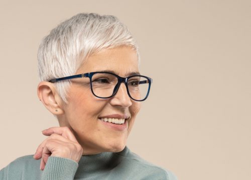 Photo of an older woman with short hair and glasses
